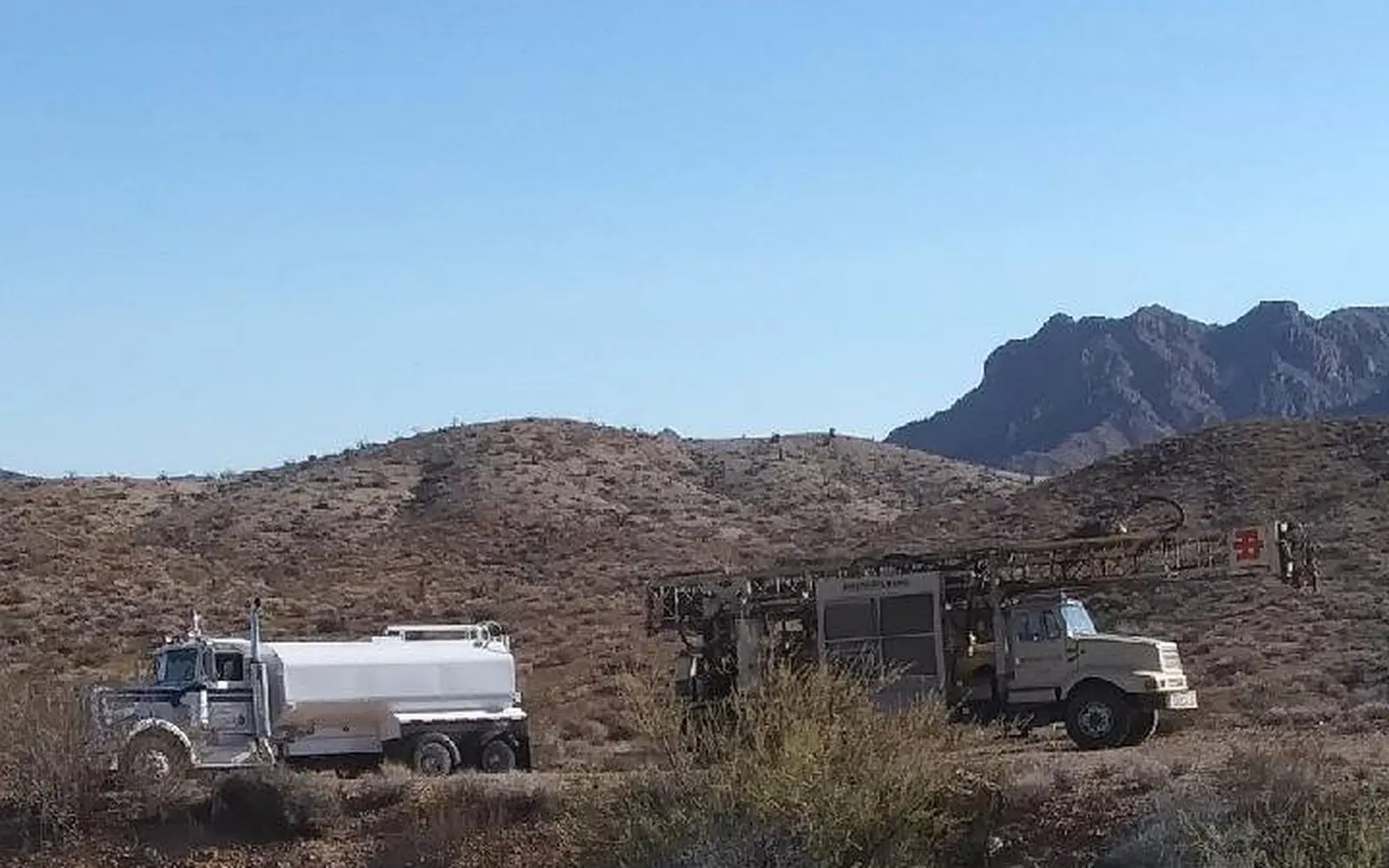 A Universal Drilling rig and water truck working a desert parcel outside Wickenburg, Arizona