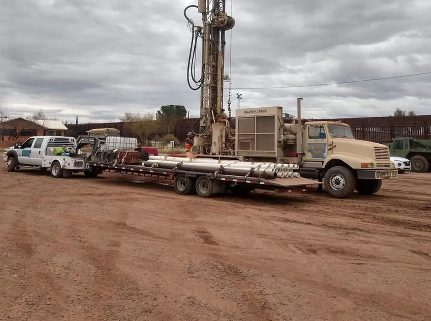 Universal Drilling's rigs and trucks staged in the Arizona desert