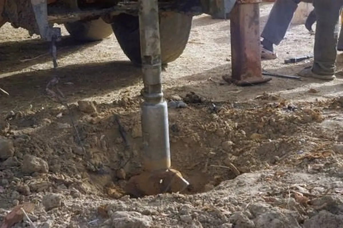 The drill stem boring into the ground